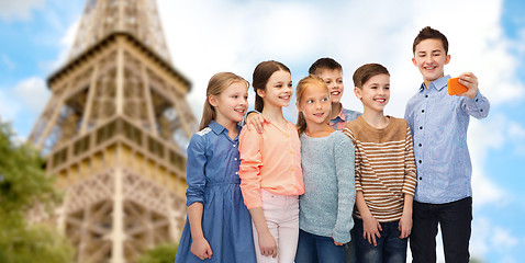 Image showing kids talking smartphone selfie over eiffel tower