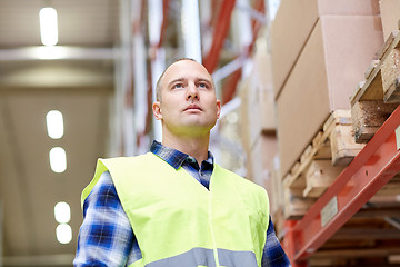 Image showing man in reflective safety vest at warehouse