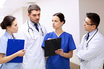 Image showing group of medics at hospital with clipboard