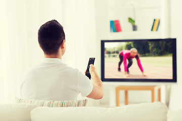 Image showing man watching sport channel on tv at home