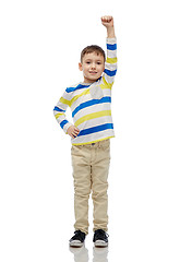 Image showing happy smiling little boy with raised hand