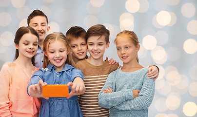 Image showing happy children talking selfie by smartphone