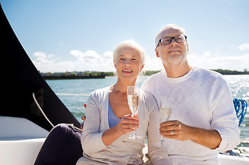 Image showing senior couple with glasses on sail boat or yacht