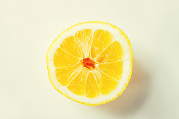 Image showing ripe orange or lemon slice over white
