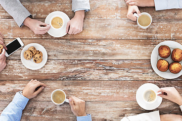 Image showing close up of business team drinking coffee on lunch