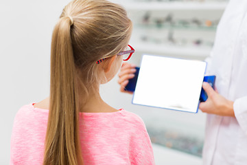 Image showing optician and girl choosing glasses at optics store