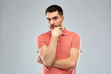 Image showing man thinking over gray background