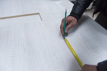 Image showing carpenter worker measuring