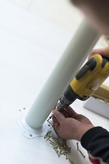 Image showing repairman working with drilling machine