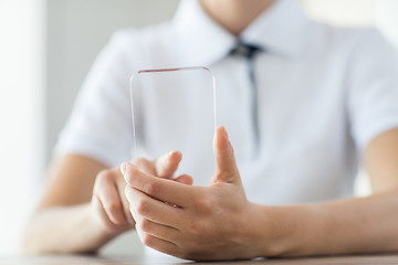 Image showing close up of woman with transparent smartphone