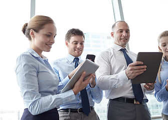 Image showing business people with tablet pc and smartphones