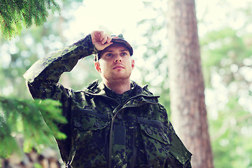 Image showing young soldier or ranger in forest