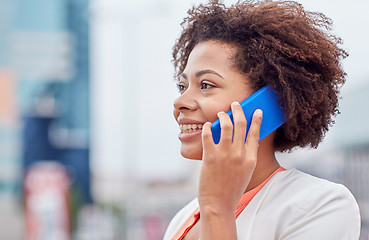 Image showing happy young african american businesswoman in city