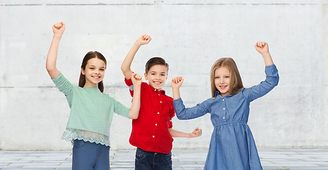 Image showing happy boy and girls celebrating victory