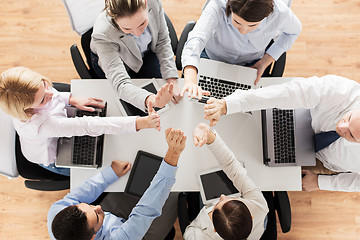 Image showing close up of business team showing high five