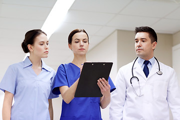 Image showing group of medics at hospital with clipboard