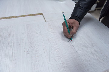 Image showing carpenter worker measuring