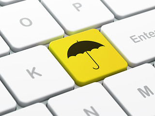 Image showing Safety concept: Umbrella on computer keyboard background
