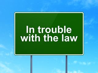 Image showing Law concept: In trouble With The law on road sign background