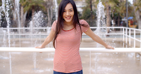 Image showing Trendy young woman outdoors in summer