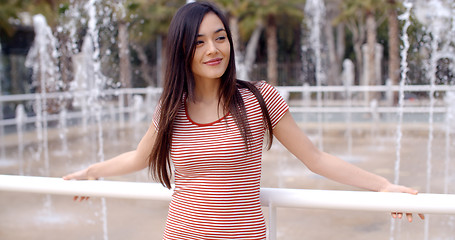Image showing Trendy young woman outdoors in summer