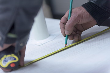 Image showing carpenter worker measuring