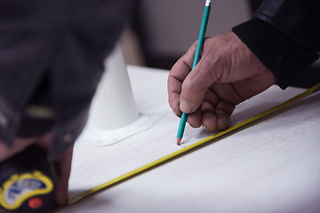 Image showing carpenter worker measuring