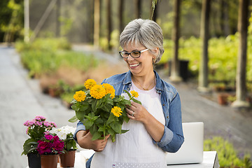 Image showing Working in a flower shop