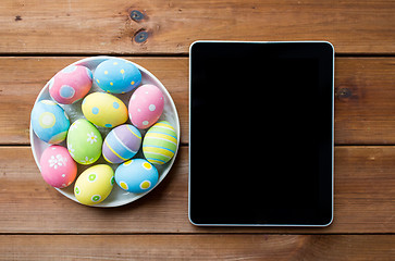 Image showing close up of easter eggs and blank tablet pc