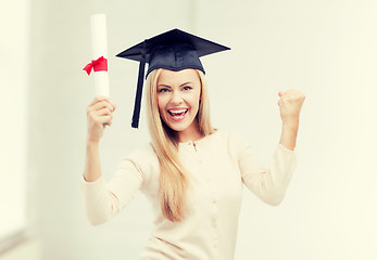 Image showing student in graduation cap with certificate