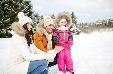 Image showing happy family with child in winter clothes outdoors