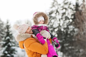 Image showing happy family in winter clothes outdoors