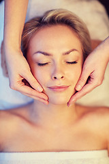 Image showing close up of woman having face massage in spa