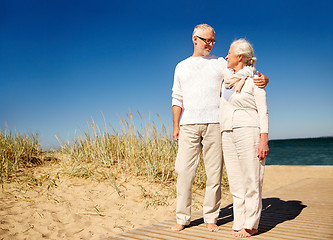 Image showing happy senior couple talking outdoors