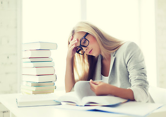 Image showing student with books and notes