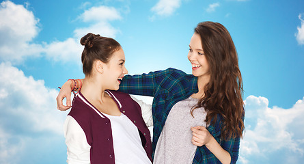 Image showing happy smiling pretty teenage girls hugging