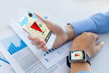 Image showing hands with navigator map on smart phone and watch