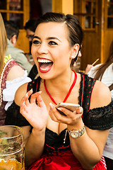 Image showing Girl drinking beer at Oktoberfest