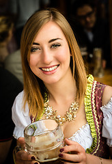 Image showing Girl drinking beer at Oktoberfest