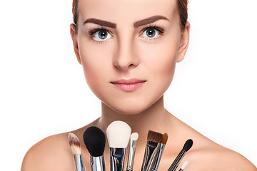 Image showing Beautiful female eyes with bright blue make-up and brush