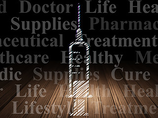 Image showing Health concept: Syringe in grunge dark room