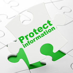 Image showing Protection concept: Protect Information on puzzle background