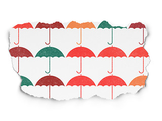 Image showing Protection concept: Umbrella icons on Torn Paper background