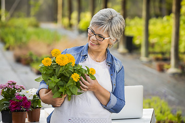 Image showing Working in a flower shop