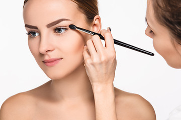 Image showing Beautiful female eyes with make-up and brush