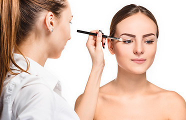 Image showing Beautiful female eyes with make-up and brush