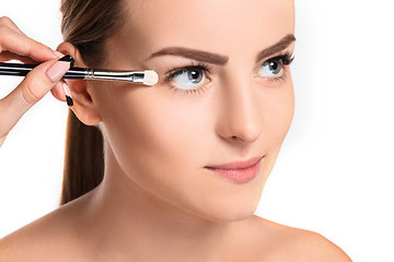 Image showing Beautiful female eyes with make-up and brush