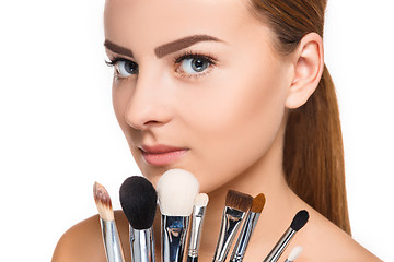 Image showing Beautiful female eyes with make-up and brushes