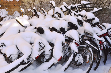 Image showing bikes covered with a blanket of snow, winter in Finland