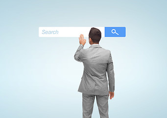 Image showing businessman with internet browser search bar